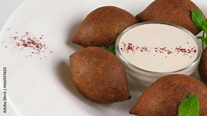 Arabic cuisine, meat appetizer kibbeh, minced meat and bulghur wheat, fried snack, loop, 4K, ProRes codec, 422 HQ, ISO 100