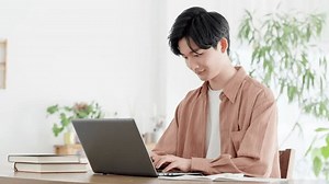 Man using laptop at home