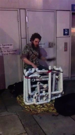 Street Performer Plays Music on PVC Pipes