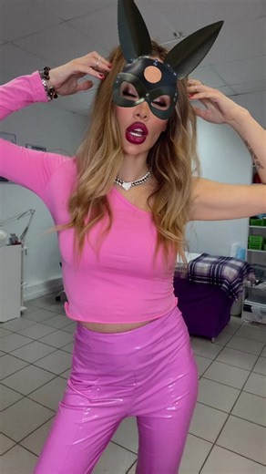 Unique Fashion Statement: Pink Outfit and Bunny Mask
