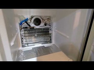 Look inside Kenmore refrigerator evaporator compartment ice clog area check if water in bottom