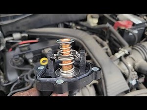 how to loosen the tensioner and change thermostat on Ford Fusion
