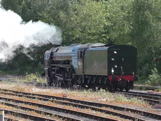 The A1 Steam Locomotive Trust LNER Peppercorn Class A1 No.60163 'Tornado' chuffs tender first through Leicester railway station without a support coach, heading for Wigston triangle to turn the loco around. The working on 23rd May 2025 was 0Z29 Humberstone Road to Humberstone Road during the run 5Z29 Nene Valley Railway to St Phillips Marsh HST depot. | PurpleVision