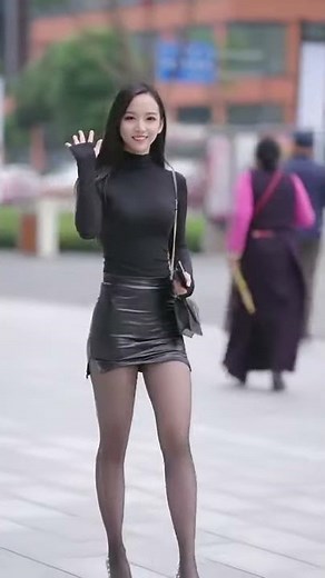 Cute girl in miniskirt walking down the street #30