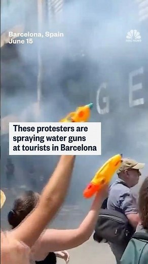 These protesters are spraying water guns at tourists in Barcelona