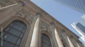 Upward view of columns colonnade on a building in downtown London skyscraper