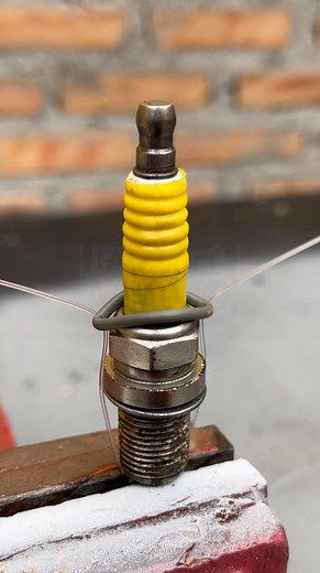 Putting the rubber onto the spark plug the right way The simple technique that slides it in perfectly. #USA #MotoHack #WorkshopTip | Millimeter DIY