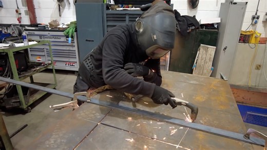 Plasma cutting steel components in the workshop