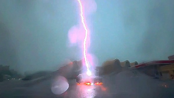 Electric car! Driver escapes unharmed after car struck by lightning