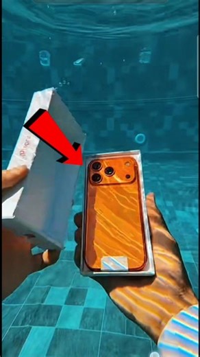 This guy is unboxing an iPhone underwater.