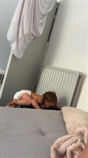 Toddler Scales Coffee Table and Beams When Spotted