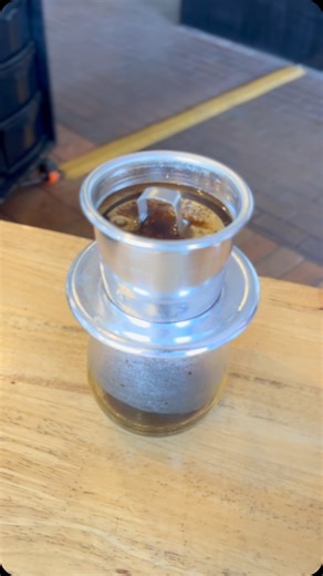 The Vietnamese coffee dripper, or “phin,” is a simple yet effective brewing device that produces a strong, rich, and often bold cup of coffee. Here’s a step-by-step guide to making coffee with a Vietnamese coffee dripper: Vietnamese Coffee Brewing Steps: •Prepare Your Glass/Mug •Assemble the Dripper and Add Coffee: •Place the filter plate of the phin on top of your glass/mug. •Remove the brewing chamber from the filter plate. •Add your measured coffee grounds (e.g., 20-25g) to the brewing chambe