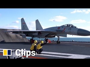 Chinese PLA Navy crew on the aircraft carrier Liaoning conduct training exercises