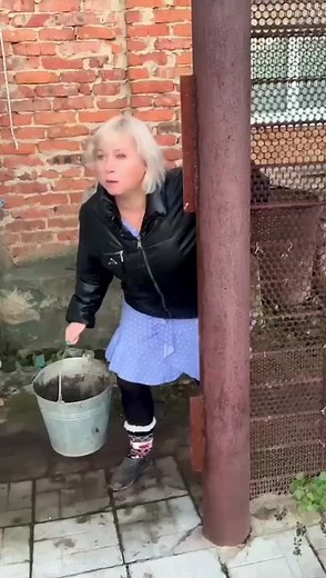 Gardening Fun: Woman Engaging with Soil in Backyard