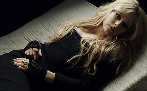 Avril Lavigne lying on a couch Rare Gallery wallpaper