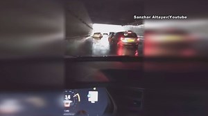 Tesla Model-S 'swims' through flooded tunnel