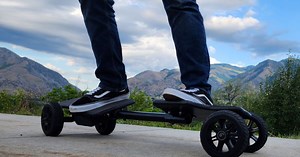 Velocity Etch electric skateboard crosses a RipStik with a longboard