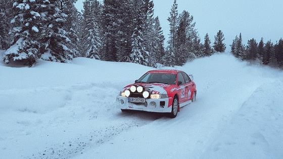 Evo driving fast on snowy backroads