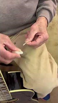 Installing a strap button on a Gibson Southern Jumbo Guitar.