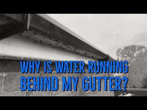Why is water running behind my gutter?