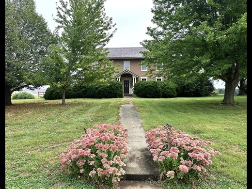 Back in the early '70s, my husband and I made the decision to raise our kids in a cozy small town, and we couldn't have been happier with that choice. We returned to my grandparents' historic home, built in 1848, right in the heart of central Illinois. It truly felt like the perfect place for our family to grow and thrive! | A Rustic Garden