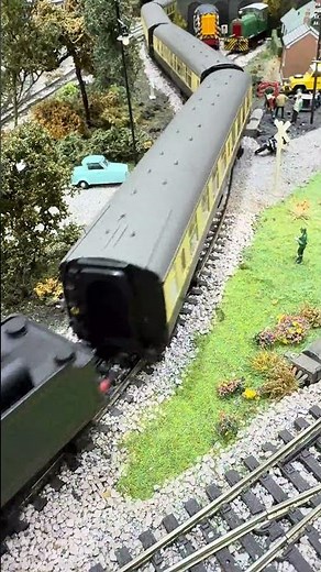Passing the Invacar Sir Walter Raleigh pulling Great Western carriages.