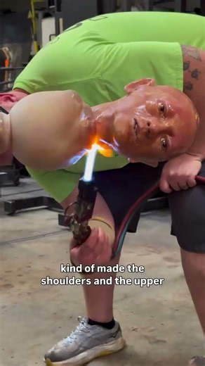 Attaching a human head made of molten glass
