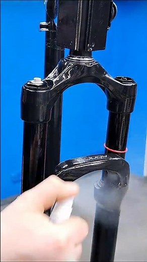 Surface cleaning of a bicycle suspension fork.