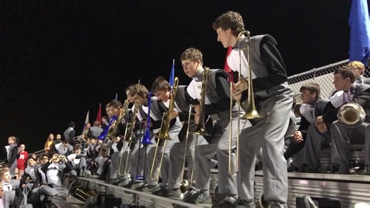 High school marching band does the trombone farewell.