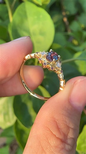 54 reactions · 3 comments | Watch the alexandrite center and amethyst cluster side stones sparkle and shift with every turn of your finger - a bloom of color and magic at your fingertips.✨ #alexandrite #uniqueengagementrings #jewelry #promisering #anniversarygift | Lovedenjewelry | Facebook