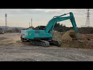 KOBELCO 0.7バックホー4tダンプに積み込み