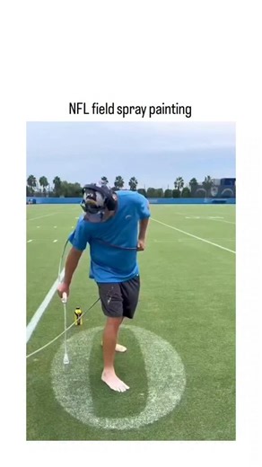 TrendTok Hub 🚀 on Instagram: "The post features a 61-second video showcasing the manual spray-painting process for NFL field markings, including precise circular end zones and team logos like the Chargers' bolt, performed barefoot by a worker using a hose-fed sprayer cart to minimize turf damage. NFL fields require about 15 gallons of diluted latex paint per full marking, a labor-intensive task often completed by grounds crews in 6-7 hours using handheld or automated sprayers, with eco-friendly