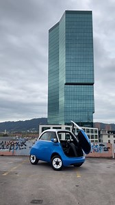 Watch as the Microlino steals the show with its unique door opening! 🚪✨ ‚And it goes like this‘ - the magic unfolds! #MicrolinoMagic #microlino #door #ev #primetower | Microlino