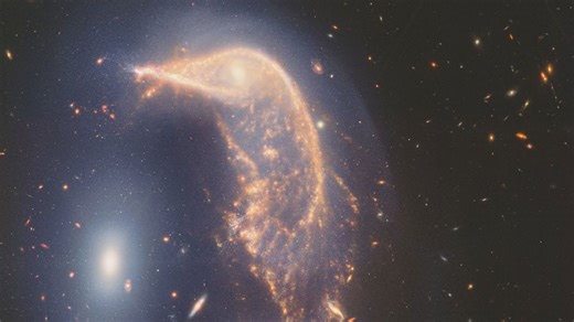 Webb Space Telescope's latest cosmic shot shows pair of intertwined galaxies glowing in infrared