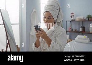 Woman wearing bathrobe in wellness spa