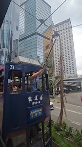 Netizens' opinion on tram driver and leaves: The driver is not authorised to engage in electrical tasks. Should accidents occur, the company will not bear responsibility. Furthermore, if a stick is necessary, why not directly move the leaves? Uncertain if they conduct electricity? If unsure, it's advisable not to interfere. | Dimsumdaily Hong Kong Wanderlust