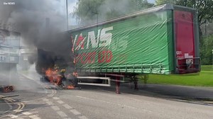 This is the moment a lorry trailer became engulfed by flames. The fire service confirmed the blaze started after one of the tyres blew out. Read the full story: bitly.ws/PbMu | ITV News West Country