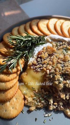 Fall Appetizer: Jam Ritz Baked Brie The best part is you can use whatever jam is on hand! Think: fig, apricot, cherry - could even go savory and do onion jam! Whatever! Make this and report back. It’s a good one to have in your back pocket. INGREDIENTS: 8 ounce Brie cheese wheel 2 tablespoons of whatever jam/preserves (I used fig) Coarsely ground pepper 8 Ritz crackers, crushed, plus more crackers for serving 1 tablespoon olive oil Flaky salt and chopped fresh rosemary, for serving DIRECTIONS: P