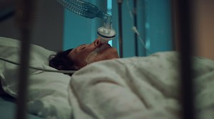 Sick woman wearing oxygen mask portrait. terminally ill person lying in ward. Free Stock Video Footage