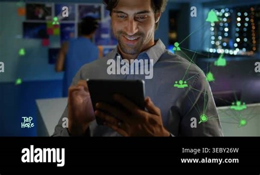 Man tapping tablet and activating green social icons while checking updates and smiling in tech hub. Office, collaboration, productivity, network, interface, device, workspace Stock Video Footage - Alamy