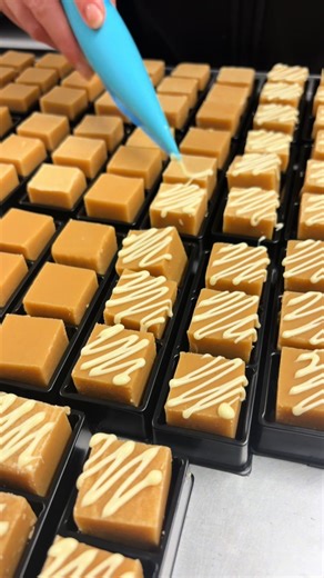Silky, golden, and getting dressed up ✨ clotted cream drizzled in white chocolate and ready for packing.. Head to the fudge kitchen website.. order yours today!✨ #fudgekitchen #fudge #whitechocolate #clottedcream #fudgegoals