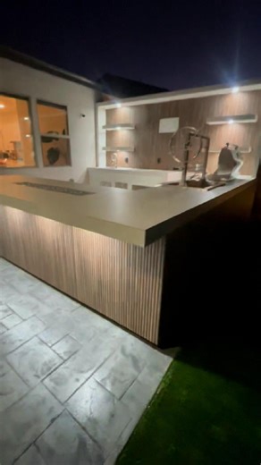 This is a serious outdoor kitchen setup. ✅ Media wall w/ space for a [85/86]