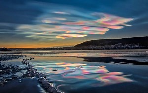 Iridescent Clouds: The Science Behind The Rainbow-Colored Phenomena (Video)