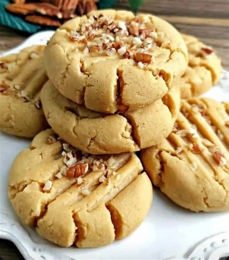 🧈 Butter Pecan Cookies Ingredients: 1 cup unsalted butter (softened) 1 cup brown sugar (packed) 1 large egg 2 tsp vanilla extract 2 cups all-purpose flour ½ tsp baking soda ¼ tsp salt 1½ cups chopped pecans (toasted) --- Instructions: 1. Toast the pecans: Preheat oven to 350°F (175°C). Spread chopped pecans on a baking sheet and toast for 5–7 minutes until fragrant. Cool completely. 2. Cream the butter and sugar: In a large bowl, beat softened butter and brown sugar until light and fluffy (abou
