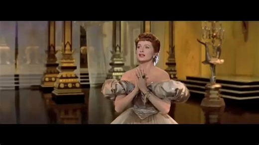 The dress should have won an Oscar for best supporting actress for this scene. She was as fantastic as the king and Anna.🎶 Yul Brynner and Deborah Kerr perform "Shall We Dance" from The King and I