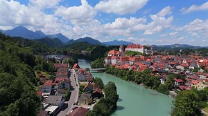 Download Fussen town and Hohes Schloss castle under bright summer sun seen from above
