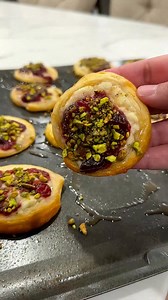 Savory crescent roll cookies make the perfect Christmas appetizer! 1 pack refrigerated crescent roll dough4oz garlic herb spread1/2 cup Cranberry sauce1/4 Chopped pistachios Hot honey(optional)Cut crescent dough into half inch thick slices(do not unroll!) Place on a sheet pan sprayed with nonstick spray. Press cookies flat. Spread garlic and herb spread on top of each cookie then top with cranberry sauce and chopped pistachios. Bake at 375° for 8-10 minutes. Cool for one minute then drizzle hot 