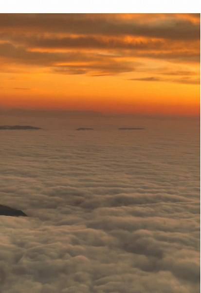 When clouds are below you at around 3,000 meters (or any elevation above their formation level), forming a vast, flat sheet-like view, the phenomenon is often referred to as a cloud inversion or a sea of clouds. This occurs when a layer of warm air traps cooler air below it, preventing the clouds from rising. This typically happens in valleys or lower areas, with the observer above the inversion layer. The “sea of clouds” often consists of stratus clouds or thick fog confined to the lower elevat