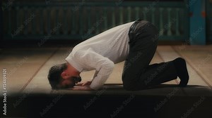 Caucasian Muslim Man Prostrating in Islamic Prayer. Ramadan Praying