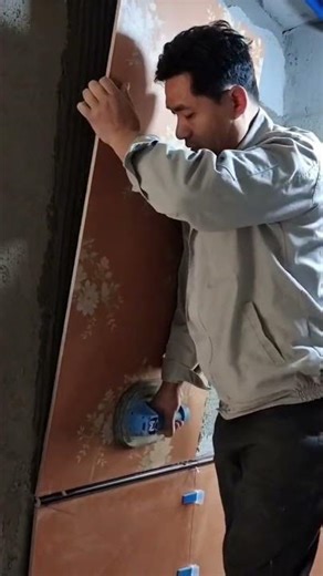 the process of installing ceramic tiles on the wall
